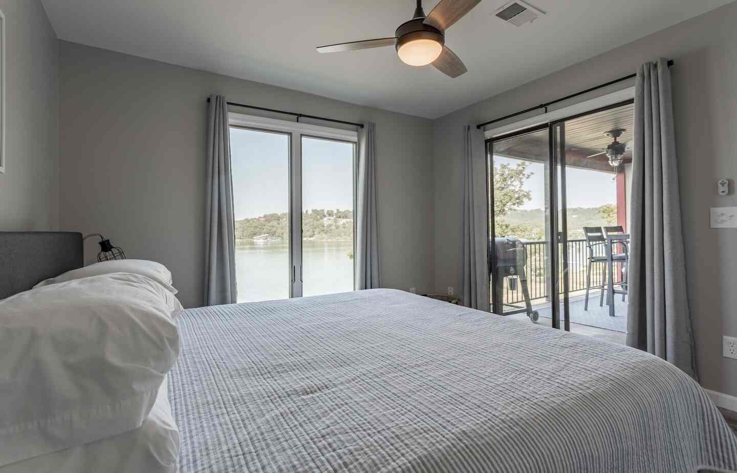 King bedroom with private balcony and Table Rock Lake view at Kimberling City Getaway
