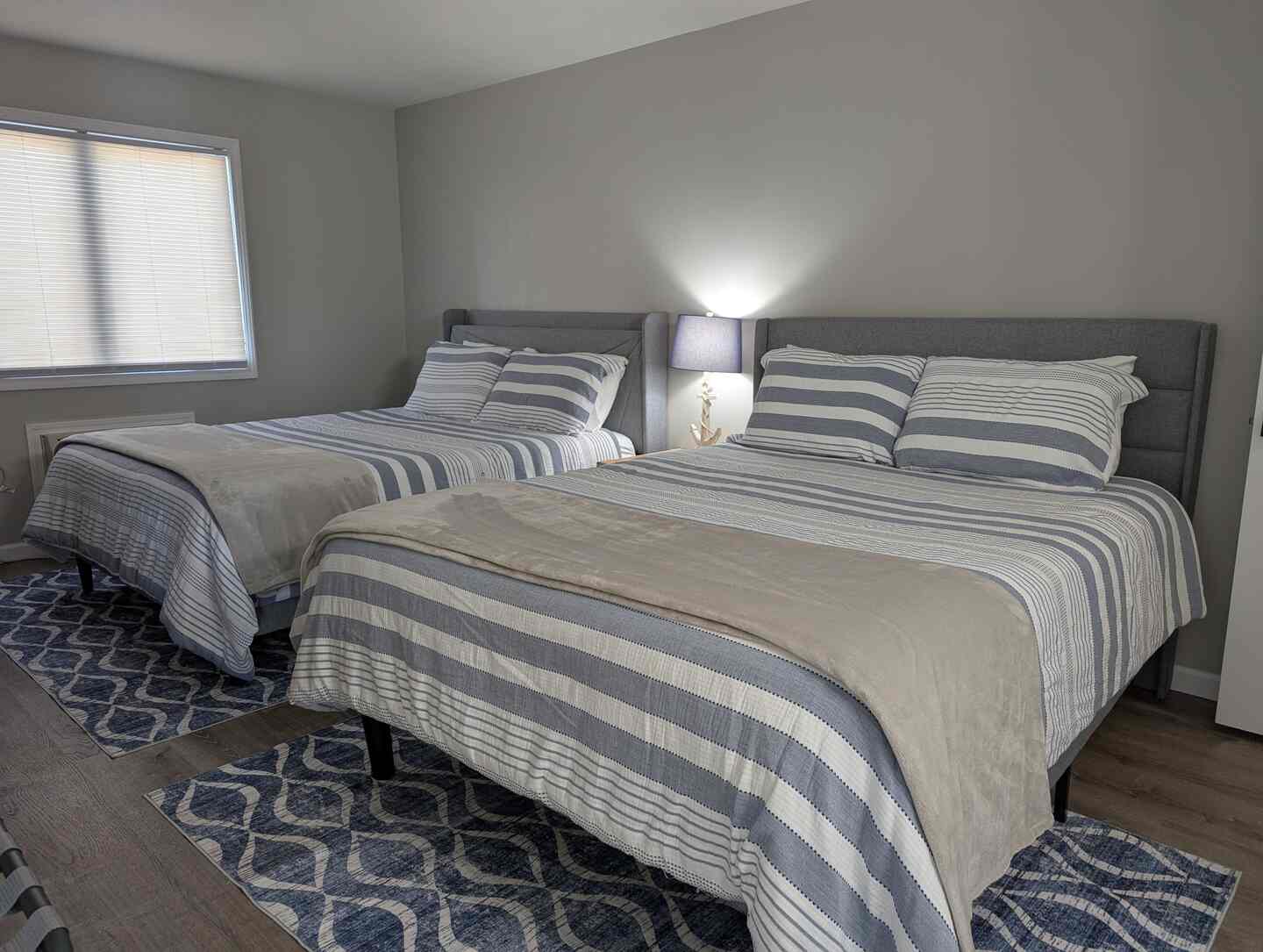 Second bedroom with two queen beds at Kimberling City Getaway