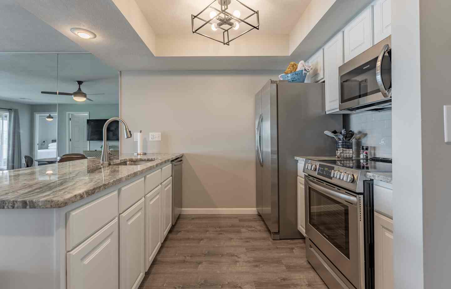 Kitchen with refrigerator and stove at Kimberling City Getaway condo