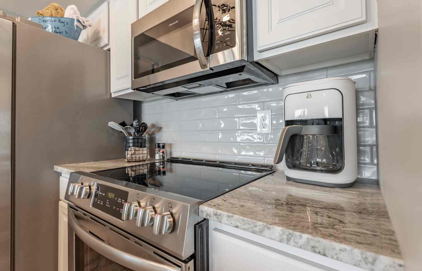 Stove and drip coffee maker in the kitchen at Kimberling City Getaway