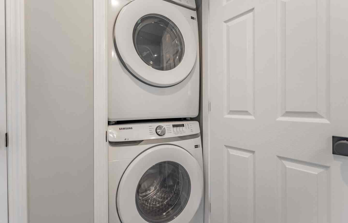 In-unit stacked washer and dryer at Kimberling City Getaway