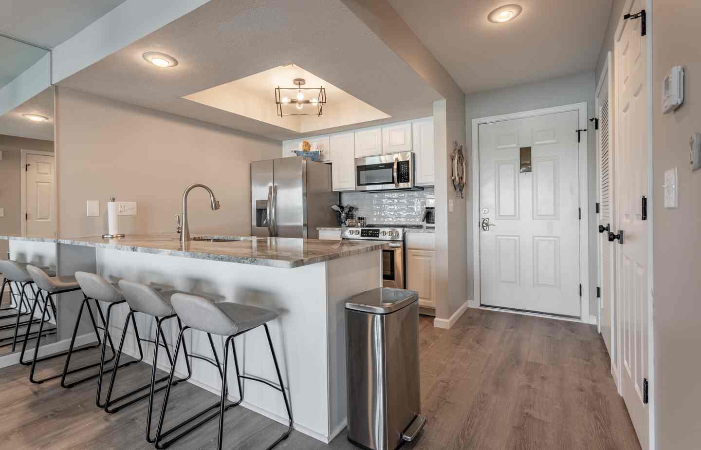 Kitchen island and entryway at Kimberling City Getaway, Table Rock Lake condo
