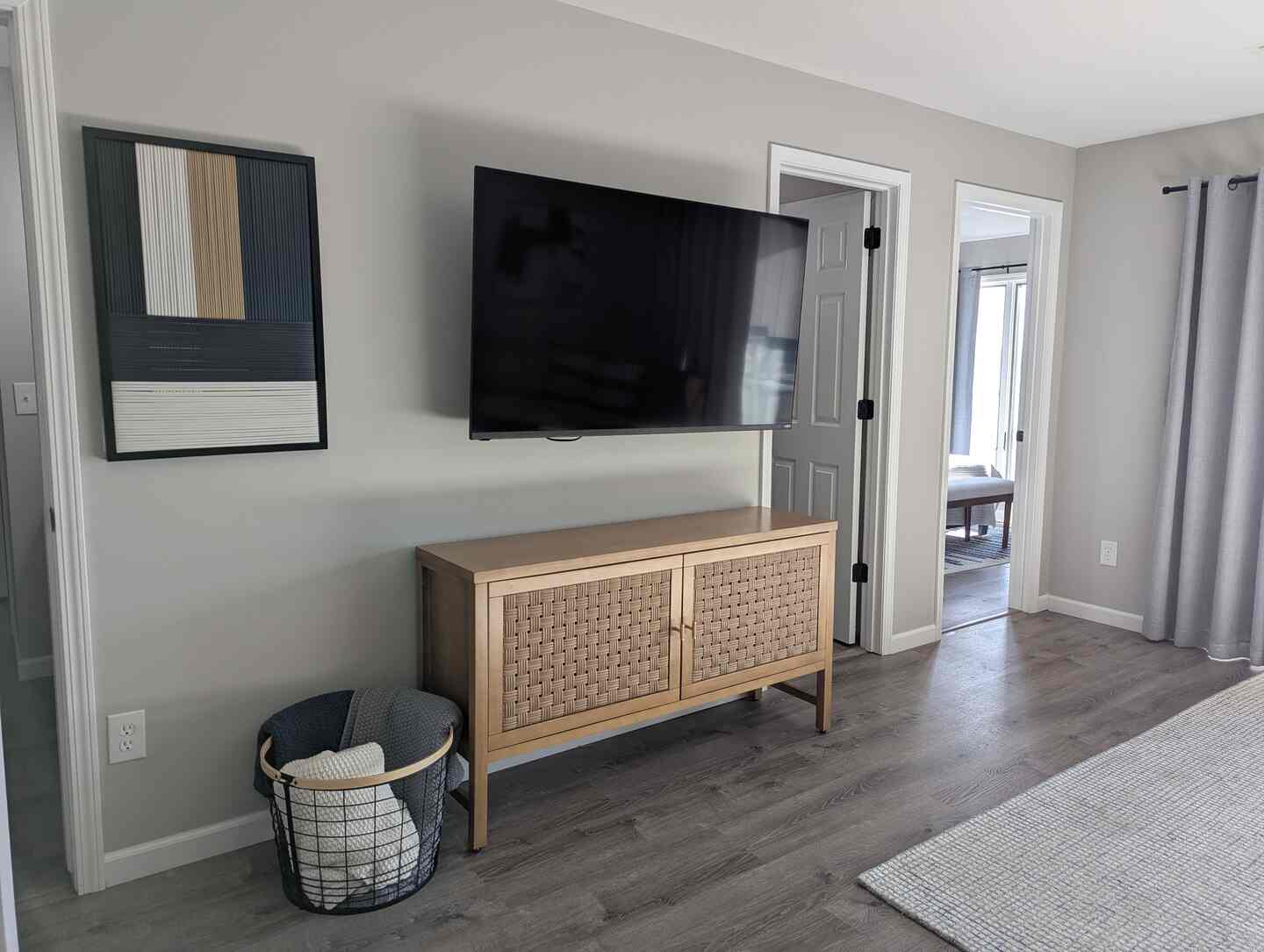 Living room with mounted TV and wood console at Kimberling City Getaway